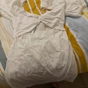 White dynamite cut out dress with tags attached